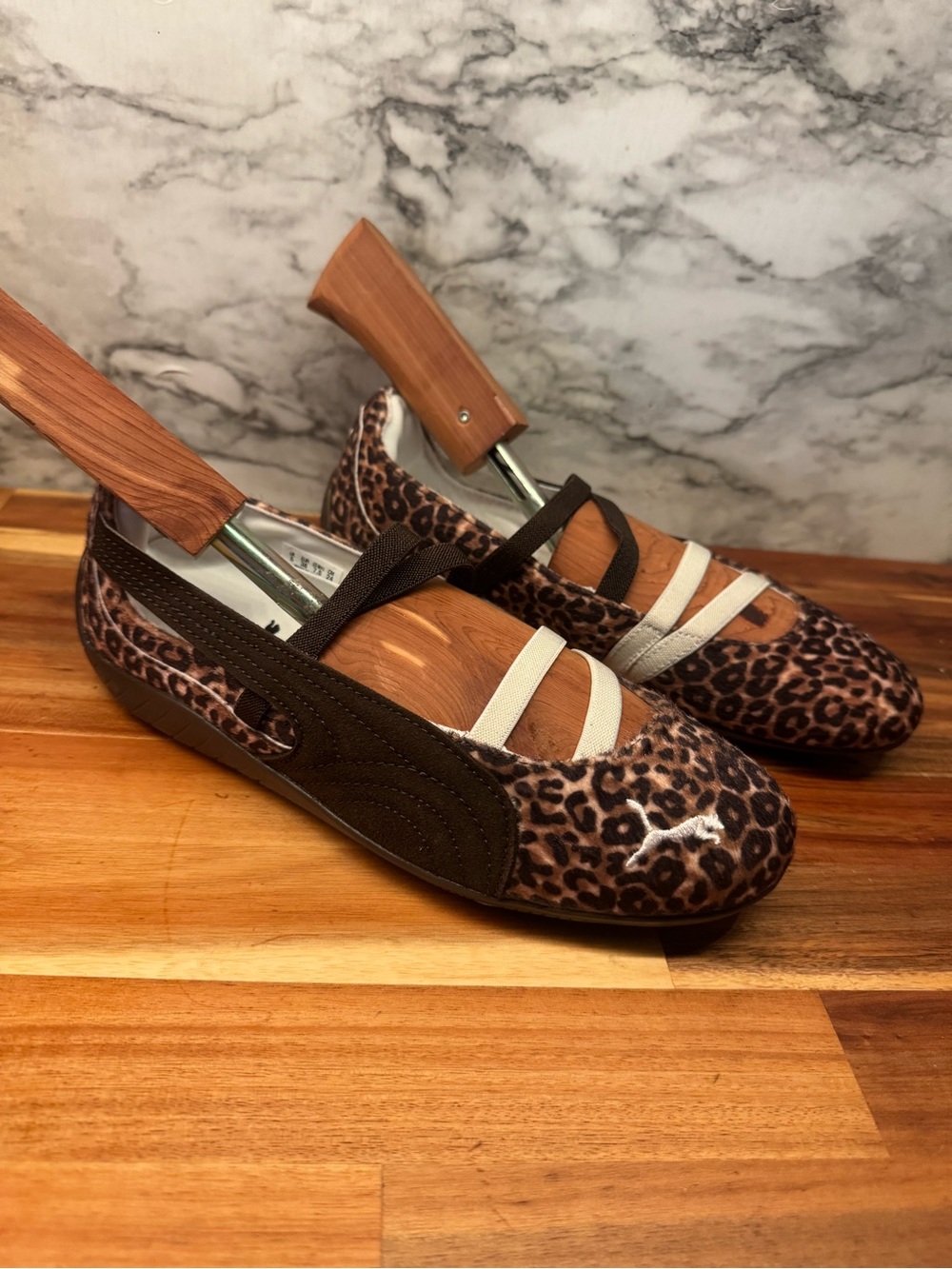 Puma Leopard Print Slip-On Flats in Brown and Black